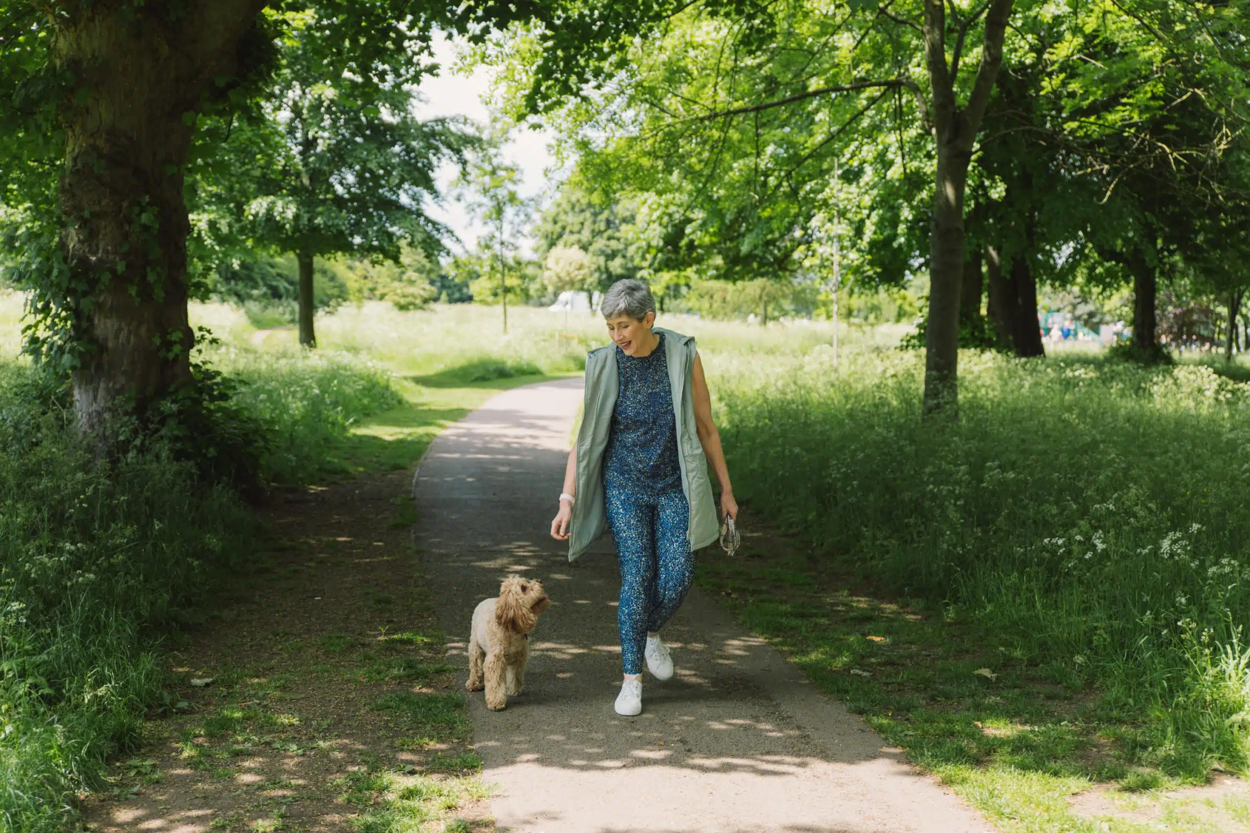 Woman walking dog