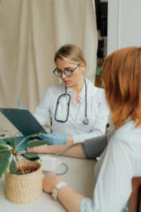 doctor checking vitals of a patient considering weight loss surgery