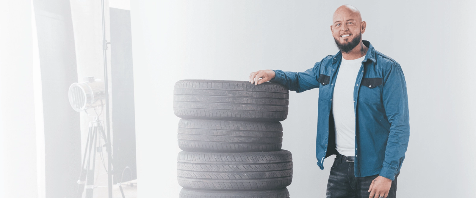 Photo of Weight Loss Patient Next to Tyres
