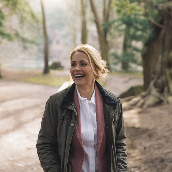 Photo of Woman Smiling in Forest